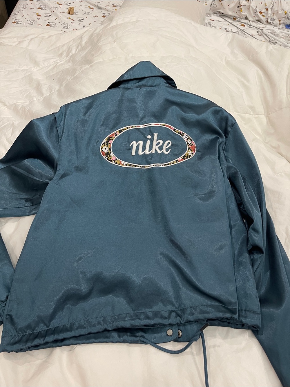 Nike Women's Satin Coach Jacket in Teal with Floral Logo